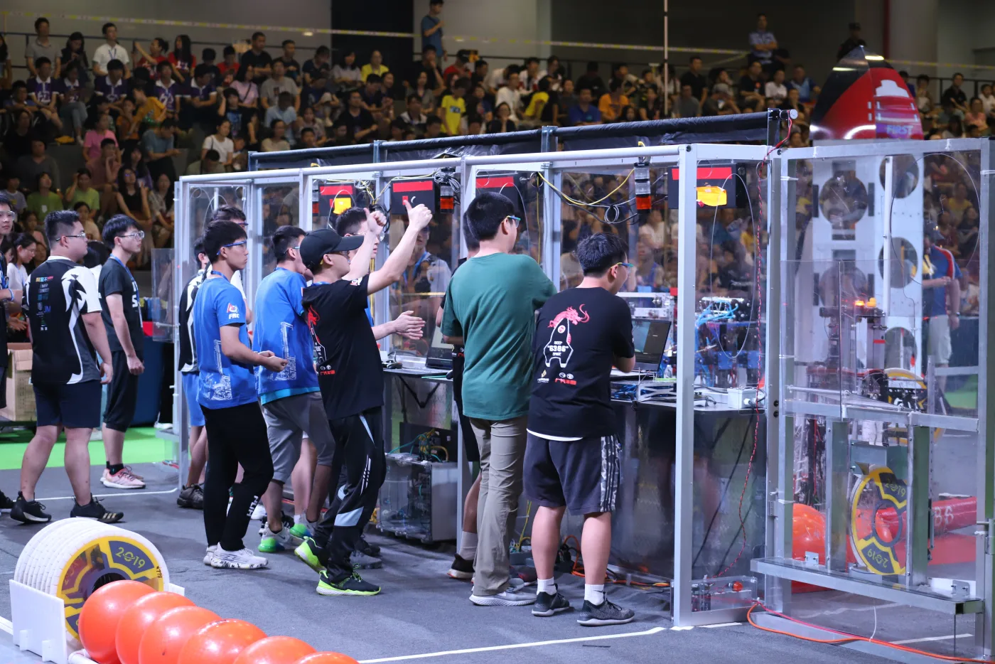 Team 6386 working beside the competition field in 2019.