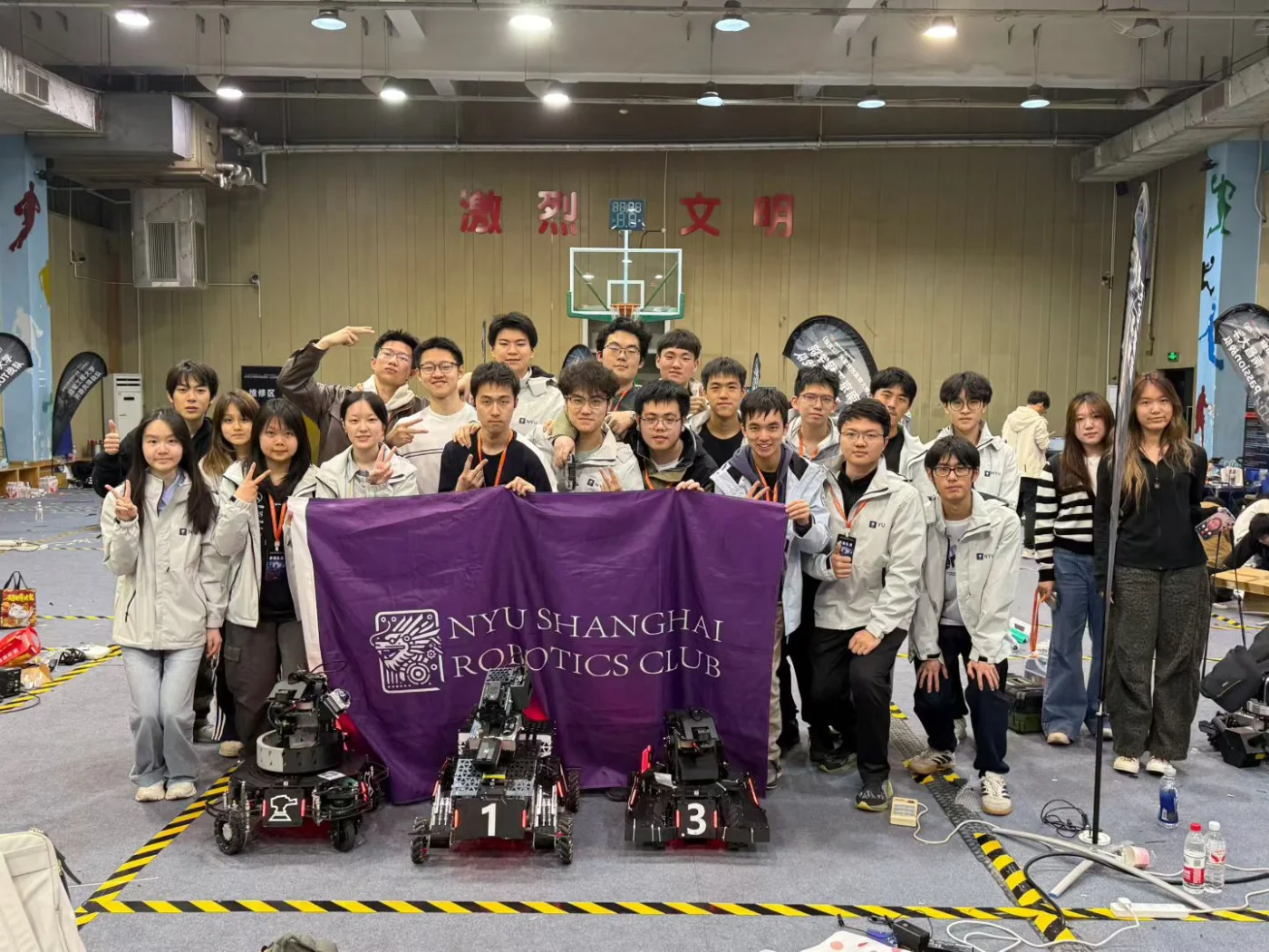 NYU Shanghai Robotics Club members with their RoboMaster robots.